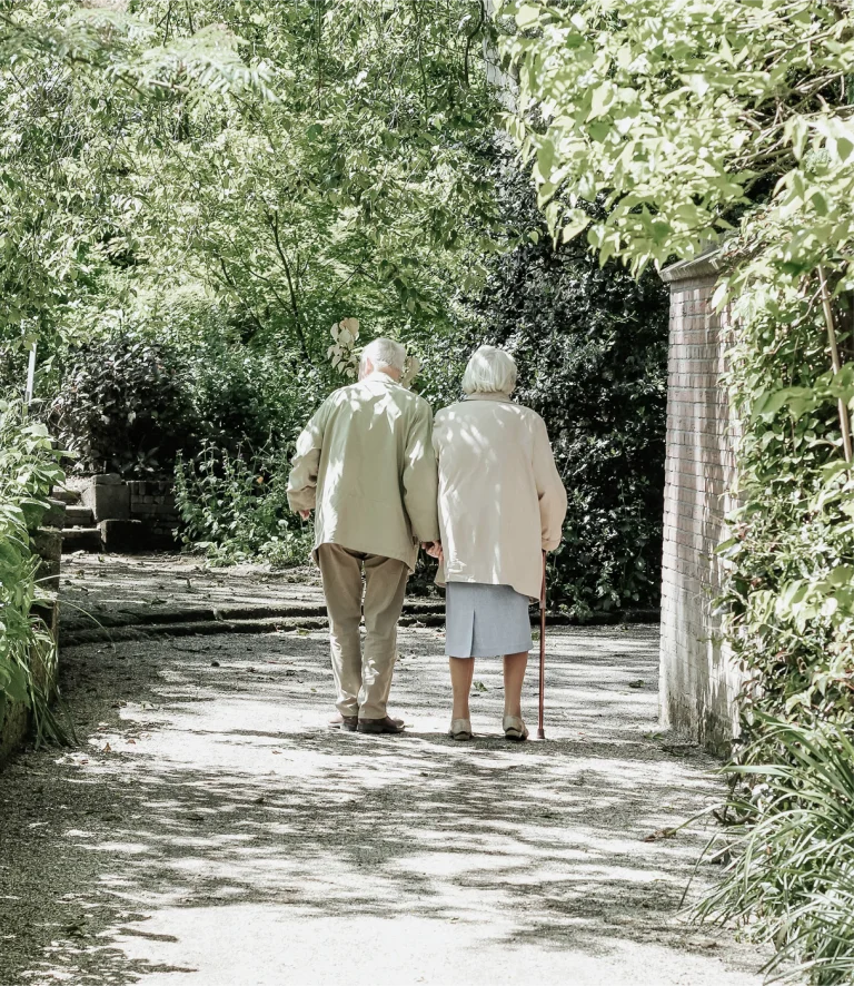 Elderly couple walking together